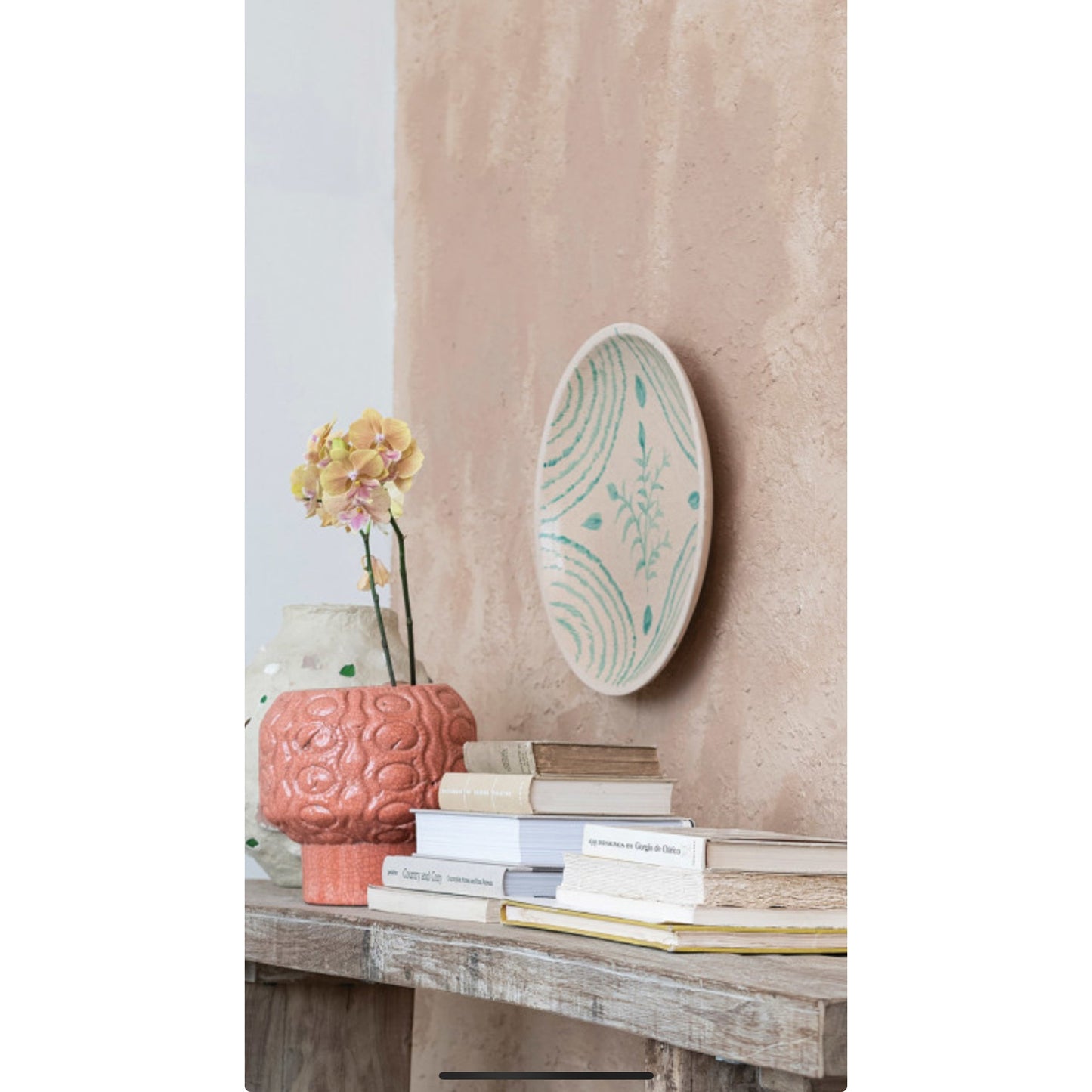 “Aqua Essence Terra-cotta Wall Plates."