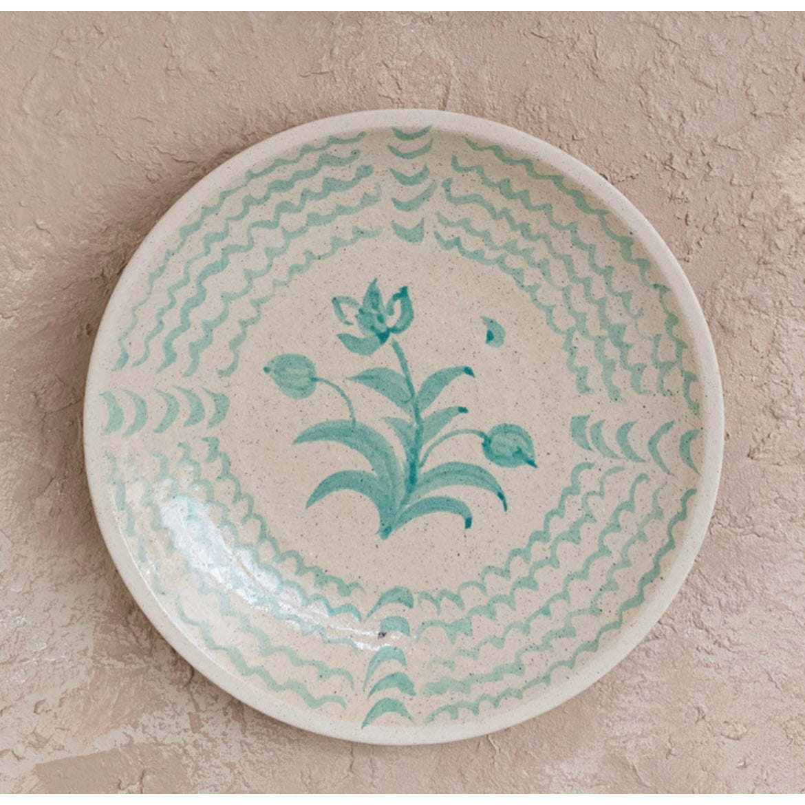 “Aqua Essence Terra-cotta Wall Plates."