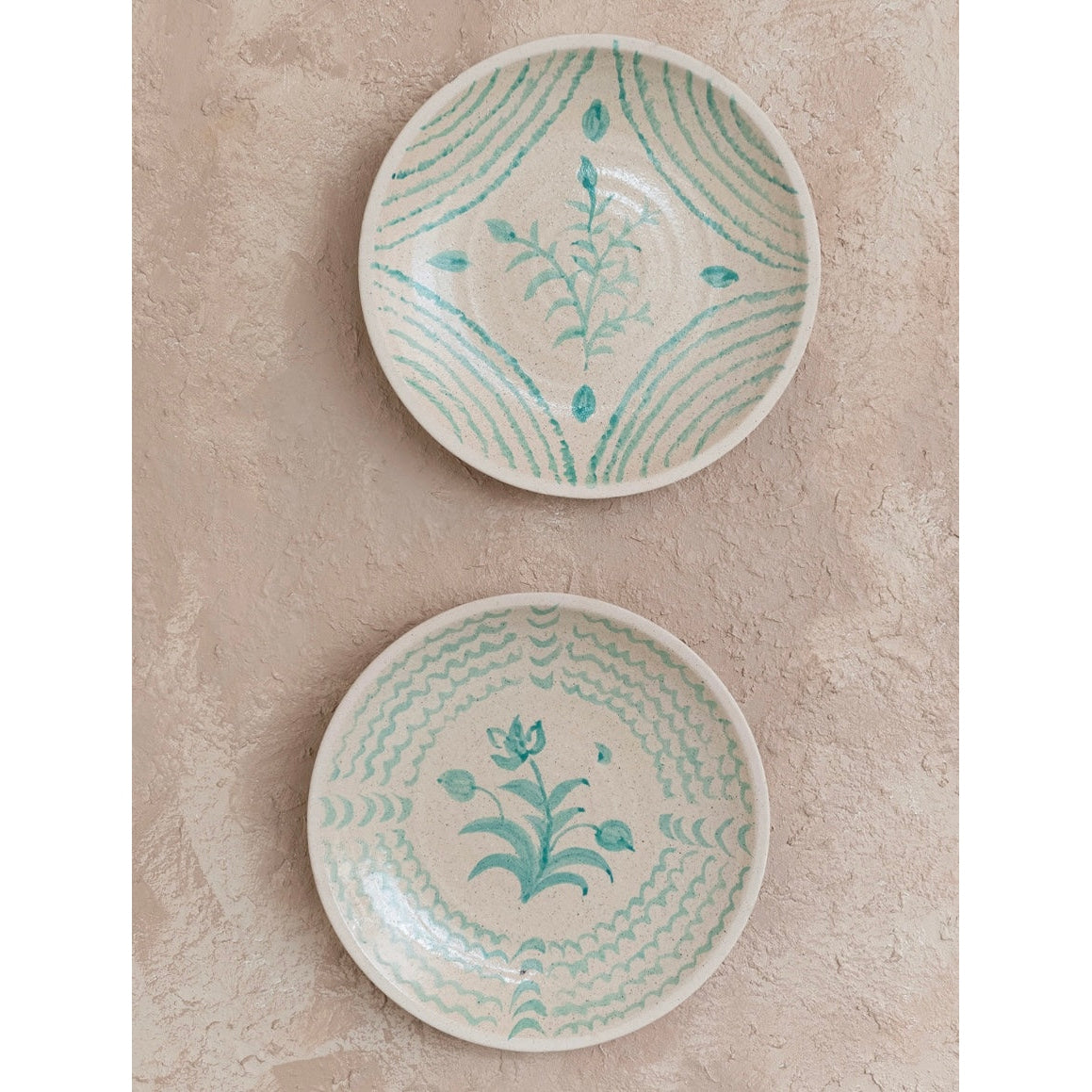 “Aqua Essence Terra-cotta Wall Plates."